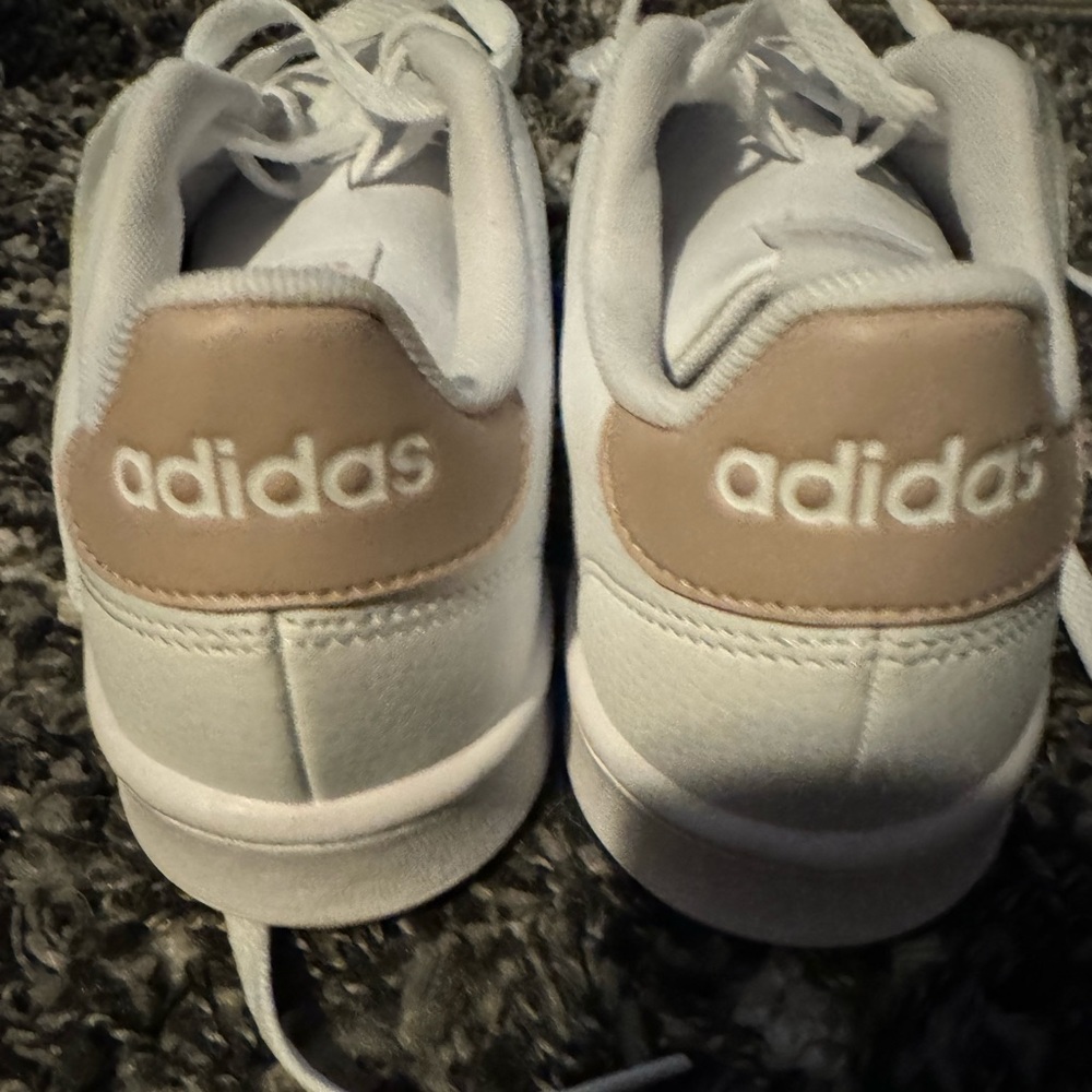 Adidas white sneakers.